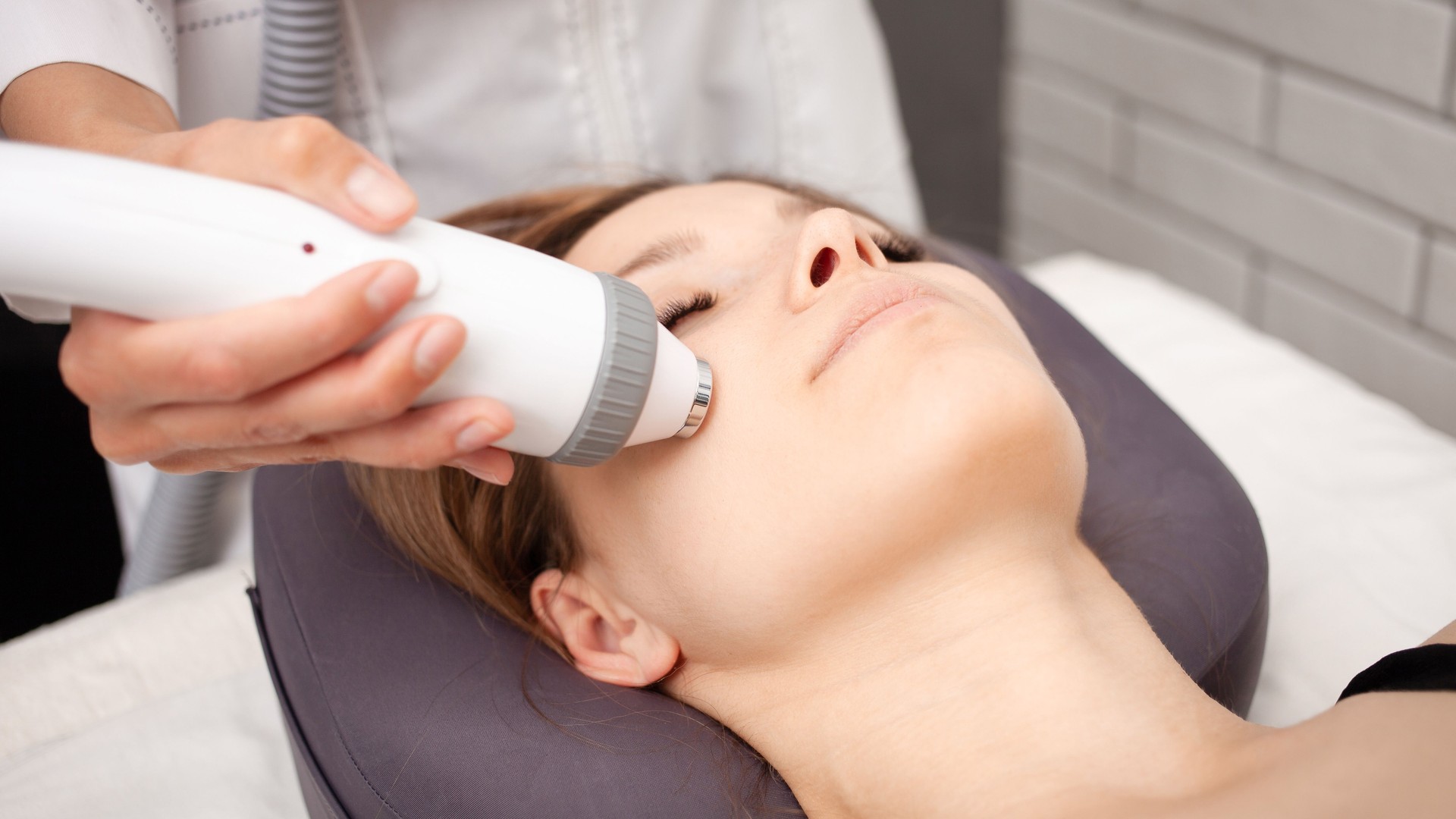 cosmetologist does rf lifting, radio waves affect skin, facelift, rejuvenation and healing. Healthy lifestyle, beautiful toned skin. cosmetology